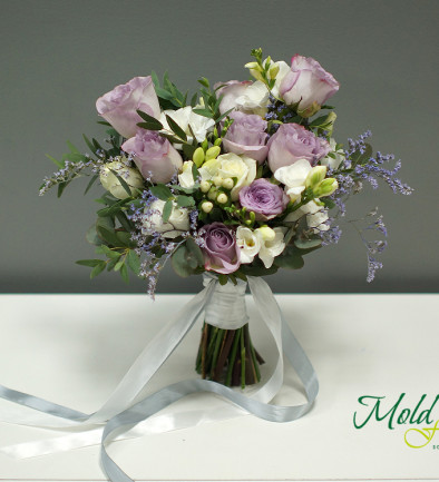 Bridal bouquet of purple roses, eustoma, and freesia photo 394x433